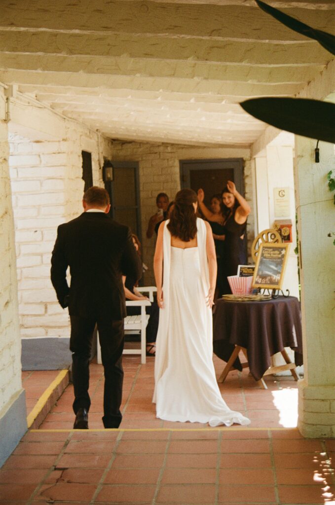 Candid wedding moment captured between Grace and Charlie at their California wedding.