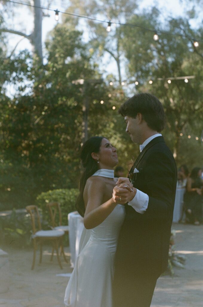 Bride and groom dancing together during their wedding reception at Leo Carillo Ranch.